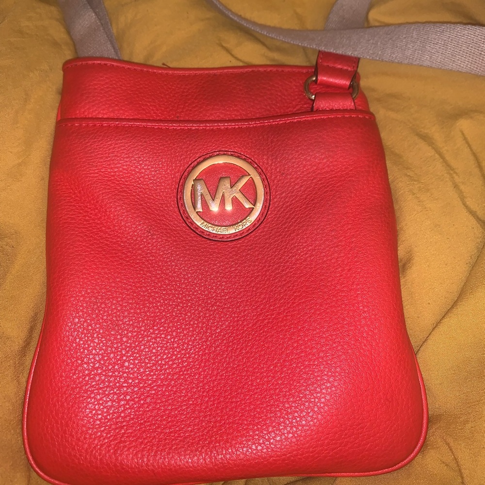 Authentic Michael Kors redish orange crossbody bag.